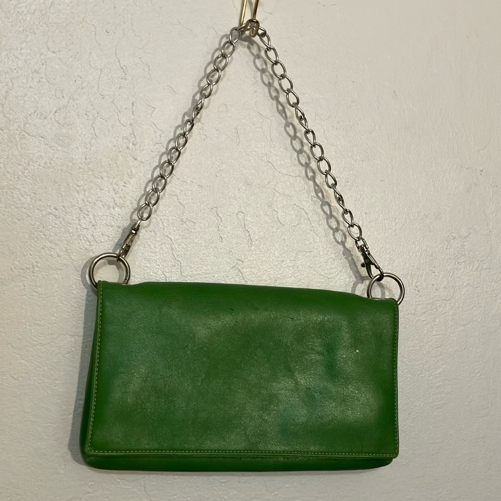 Green handbag with purple lining  and chain handle